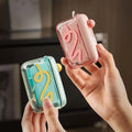 Travel-sized storage case - features an automatic pop-up dispenser, portable and refillable